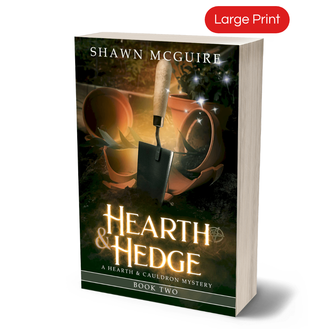 Cover of Shawn McGuire’s witch cozy midlife mysteries with broken plant pots and a hand trowel.