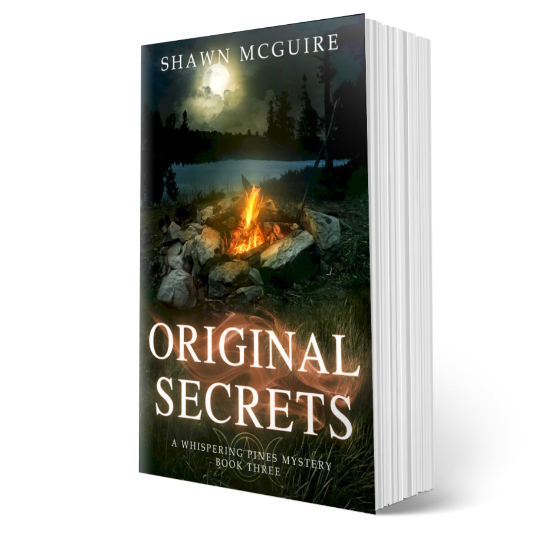 Cover of Shawn McGuire's cozy murder mystery with a campfire by a lake at night with a full moon in the sky.