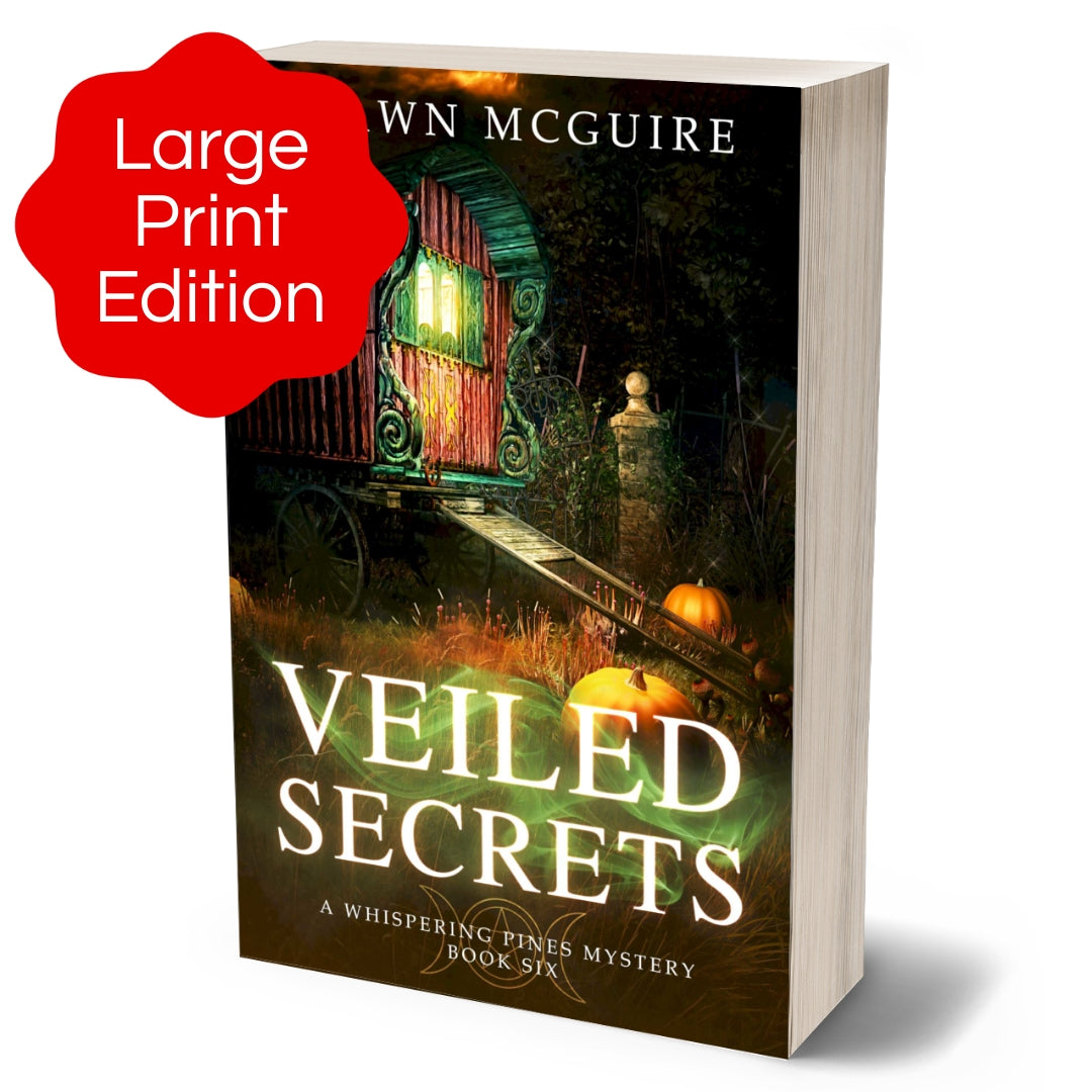 Large print paperback cover of Shawn McGuire's cozy murder mystery featuring a fortune teller’s wagon and Halloween pumpkins.