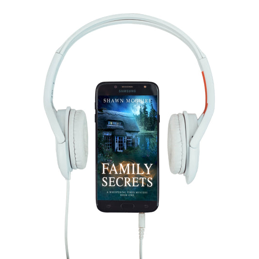Audiobook cover on cellphone for Shawn McGuire’s cozy mystery set in Whispering Pines, featuring natural woodland elements and a mysterious ambiance.