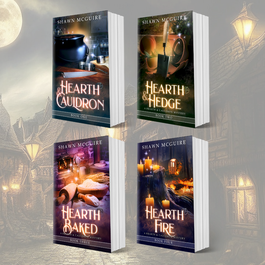 Paperback covers of Shawn McGuire’s 4-book cozy murder mystery series 