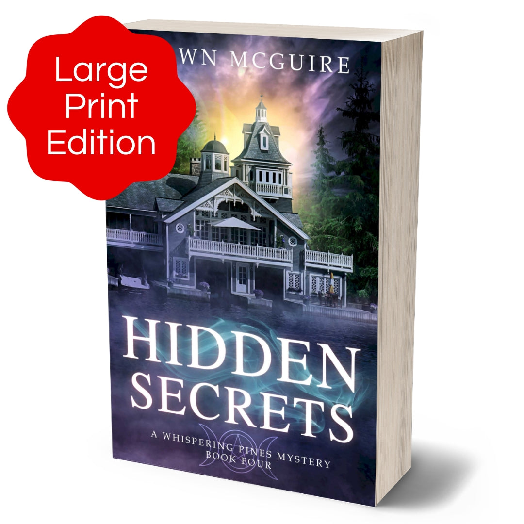 Large print paperback cover of Shawn McGuire's cozy murder mystery featuring a beautiful house on a lake.