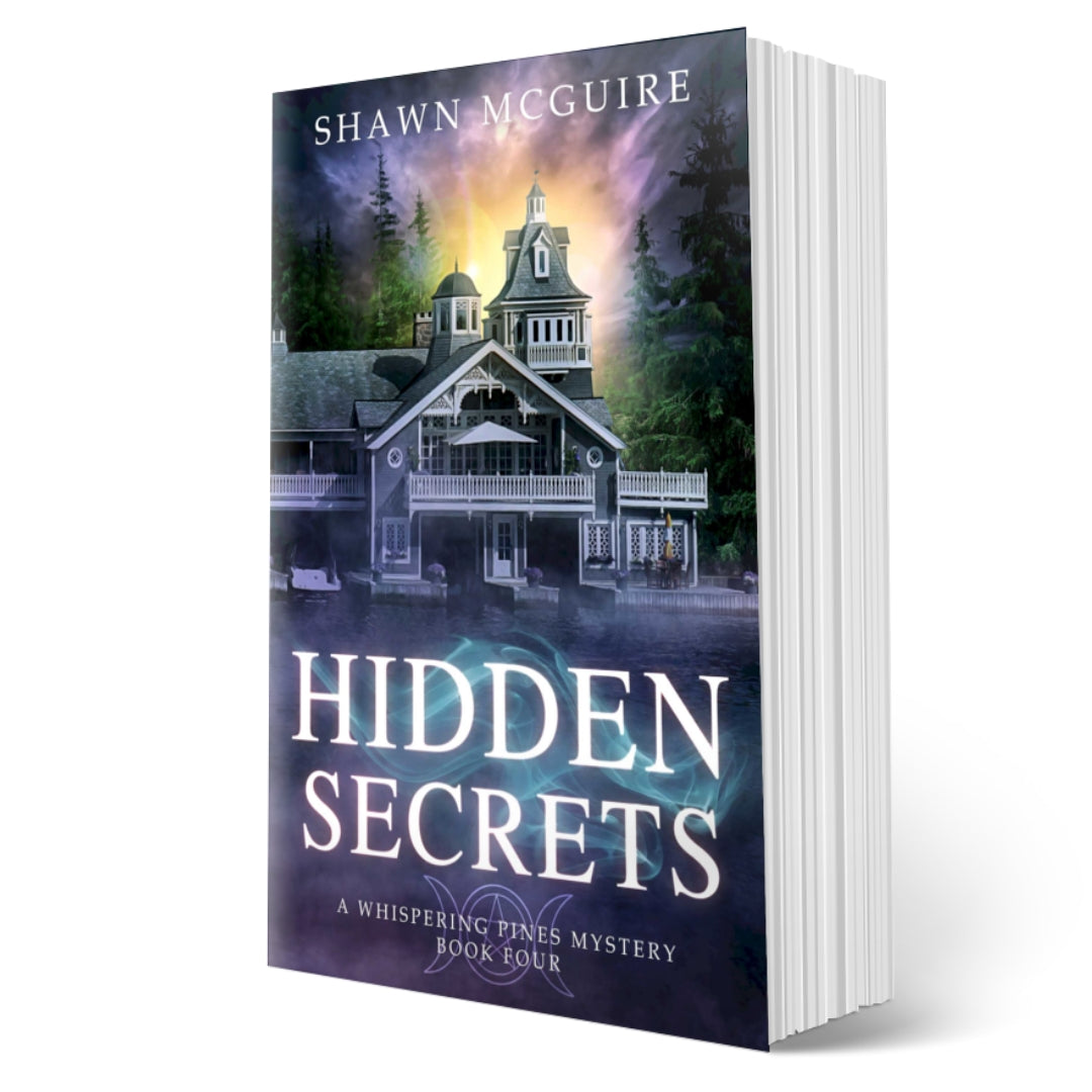 Paperback cover of Shawn McGuire's cozy murder mystery featuring a beautiful house on a lake.