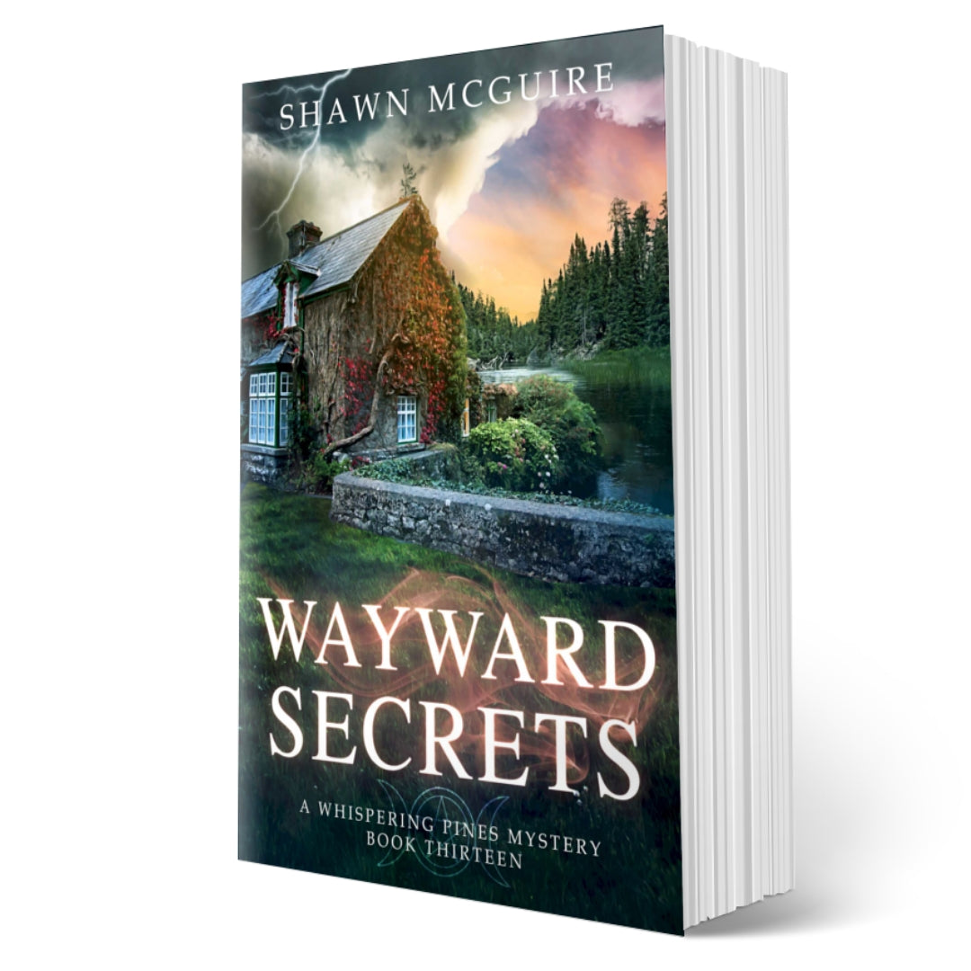 Cover of Shawn McGuire's cozy murder mystery featuring a stone cottage on a lake beneath an ominous sky.