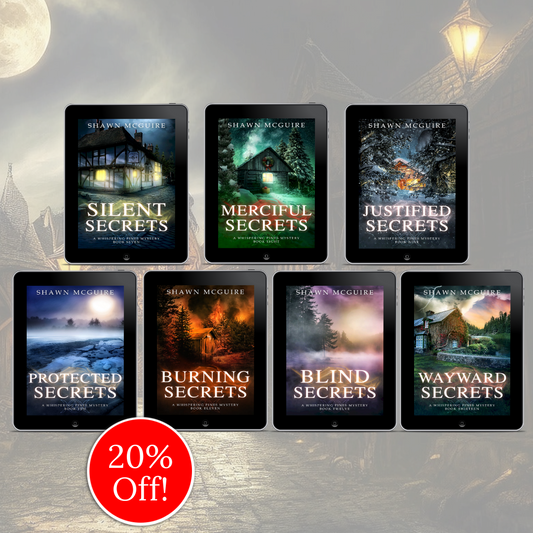 E-book covers on e-readers of Shawn McGuire’s 13-book cozy murder mystery series collection books 7-13.