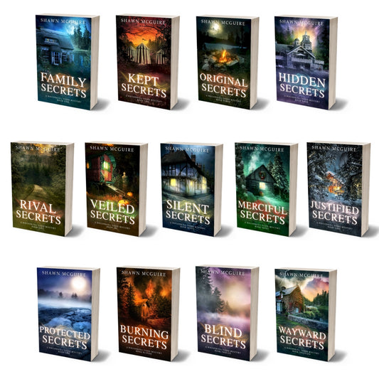 Paperback covers of Shawn McGuire 13-book cozy murder mystery series collection.
